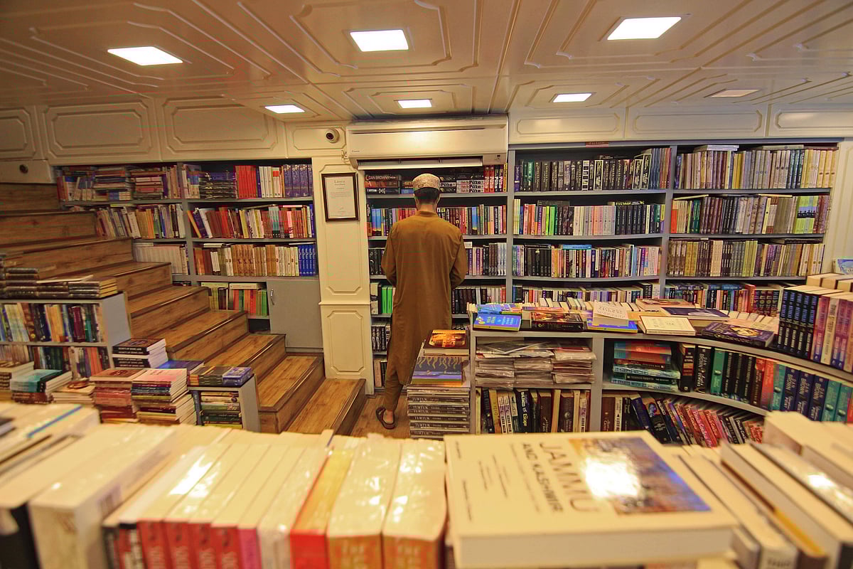 A man arranges books at his store in Srinagar, Kashmir, India, on August 12, 2025. The government of Jammu and Kashmir bans the sale, publication, and circulation of 25 books, alleging that the books propagate false narratives, glorify terrorism, and promote secessionism. The Jammu and Kashmir police conduct raids on several bookstores across the valley and confiscate the publications. - IMAGO