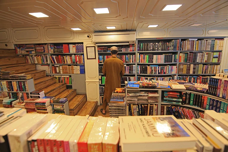 A man arranges books at his store in Srinagar, Kashmir, India, on August 12, 2025. The government of Jammu and Kashmir bans the sale, publication, and circulation of 25 books, alleging that the books propagate false narratives, glorify terrorism, and promote secessionism. The Jammu and Kashmir police conduct raids on several bookstores across the valley and confiscate the publications. - IMAGO