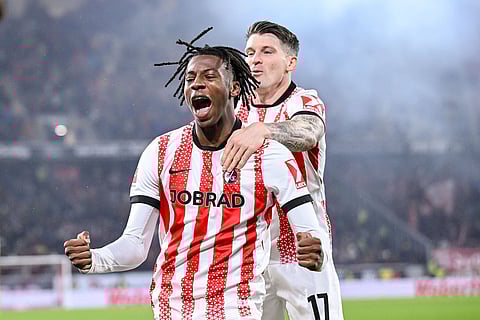 Johan Manzambi of SC Freiburg celebrates with teammate  Lukas Kübler after scoring a goal, during a German Bundesliga soccer match between SC Freiburg and 1. FSV Mainz 05, in Freiburg im Breisgau, Germany.