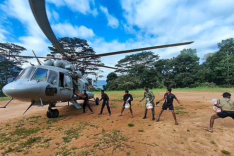 Indian Air Force (IAF) personnel transport relief material to a cyclone-affected area as part of 'Operation Sagar Bandhu', in Sri Lanka. 