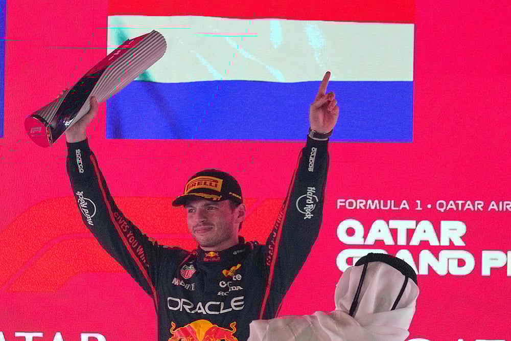 Red Bull driver Max Verstappen of the Netherlands celebrates after winning the Qatar Formula One Grand Prix, in Lusail, Qatar. - | Photo: AP/Altaf Qadri