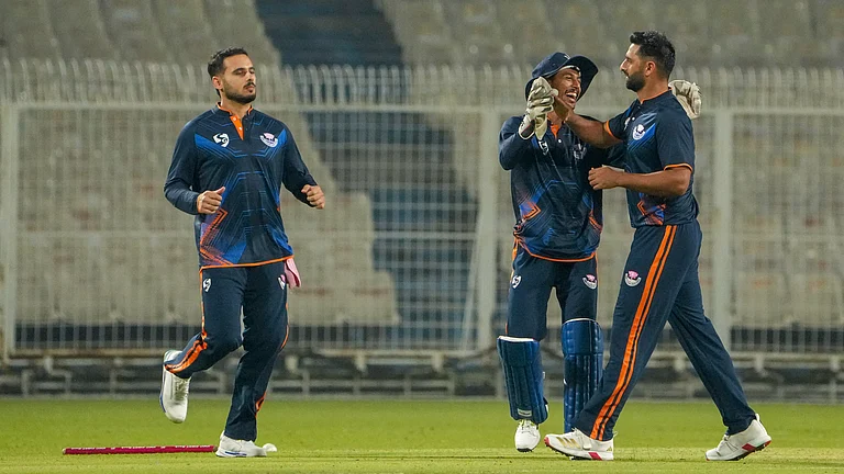 Jammu and Kashmir's Auqib Nabi, right, celebrates with teammates after taking the wicket of Bihar's Vaibhav Suryavanshi during a Syed Mushtaq Ali Trophy 2025 match in in Kolkata. - PTI