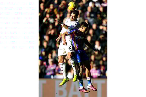 Manchester United's Diogo Dalot, left, and Crystal Palace's Daniel Munoz in action during the English Premier League soccer match between Crystal Palace and Manchester United in London.