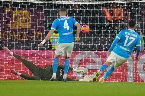 Napoli's Vanja Milinkovic-Savic saves on an attempt to score by Roma's Tommaso Baldanzi during the Serie A soccer match between Roma and Napoli in Rome.