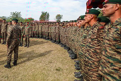 Newly recruited Indian military personnel celebrate after the Passing Out Parade of the 161 Infantry Battalion (Territorial Army), at the JAKLI Regimental Training Centre in Dhansal, on the outskirts of Jammu.