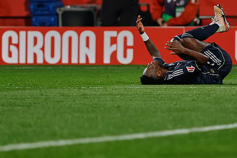 Real Madrid's Vinicius Junior reacts during a Spanish La Liga soccer match between Girona and Real Madrid, in Girona, Spain.