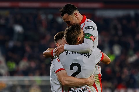Girona players celebrate Azzedine Ounahi's goal during a Spanish La Liga soccer match between Girona and Real Madrid in Girona, Spain.