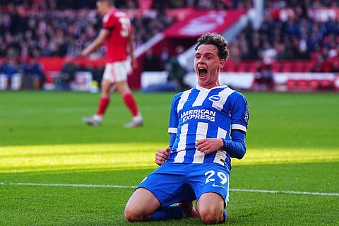 Brighton and Hove Albion's Maxim De Cuyper celebrates scoring his side's first goal of the game, during the English Premier League soccer match between Nottingham Forest and Bright and Hove Albion,  at the City Ground, in Nottingham, England.