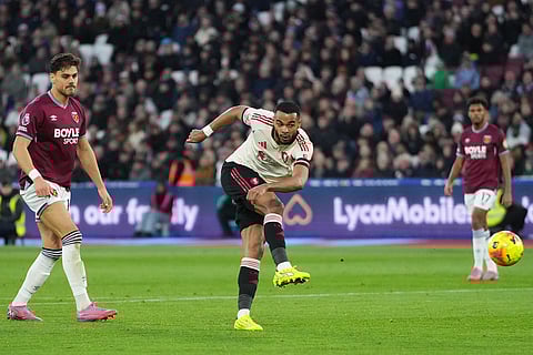 Liverpool's Cody Gakpo scores his side's second goal during the English Premier League soccer match between West Ham United and Liverpool, in London.