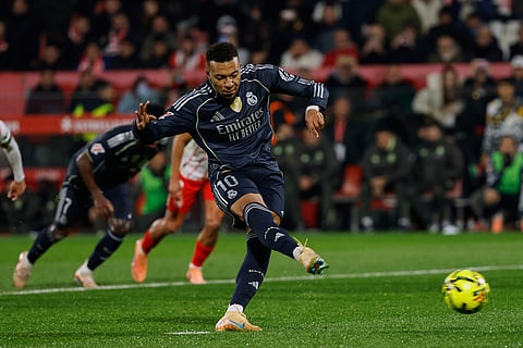 Real Madrid's Kylian Mbappe scores a penalty kick during a Spanish La Liga soccer match between Girona and Real Madrid, in Girona, Spain.