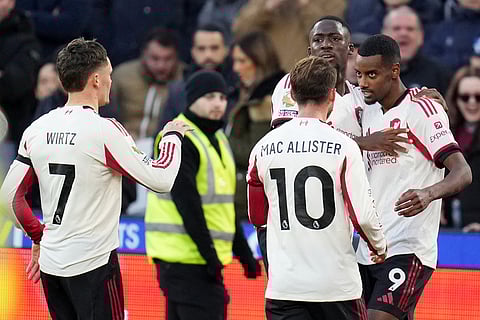 Liverpool's Alexander Isak celebrates with teammates after scoring during the English Premier League soccer match between West Ham United and Liverpool in London.