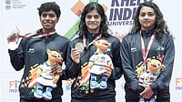 Special Arrangement : Pratyasa Ray (center) poses with her gold medal at KIUG Rajasthan 2025