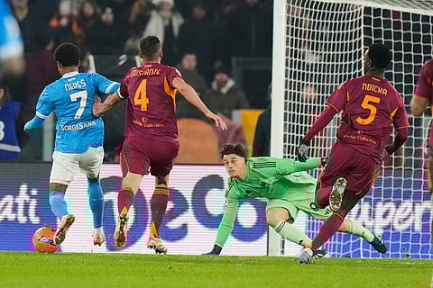 Napoli's David Neres scores is side's first goal during the Serie A soccer match between Roma and Napoli in Rome.