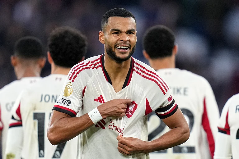 Liverpool's Cody Gakpo celebrates after scoring his side's second goal during the English Premier League soccer match between West Ham United and Liverpool, in London. - | Photo: AP/Kirsty Wigglesworth
