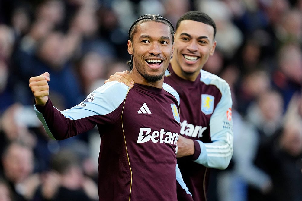 Aston Villa's Boubacar Kamara, foreground, celebrates with Aston Villa's Morgan Rogers after scoring his side's first goal, during the English Premier League soccer match between Aston Villa and Wolverhampton Wanderers, at Villa Park, in Birmingham, England. - | Photo: Nick Potts/PA via AP