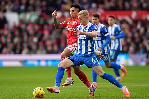 Nottingham Forest's Igor Jesus background center and Brighton and Hove Albion's Jan Paul van Hecke vie for the ball, during the English Premier League soccer match between Nottingham Forest and Bright and Hove Albion,  at the City Ground, in Nottingham, England.