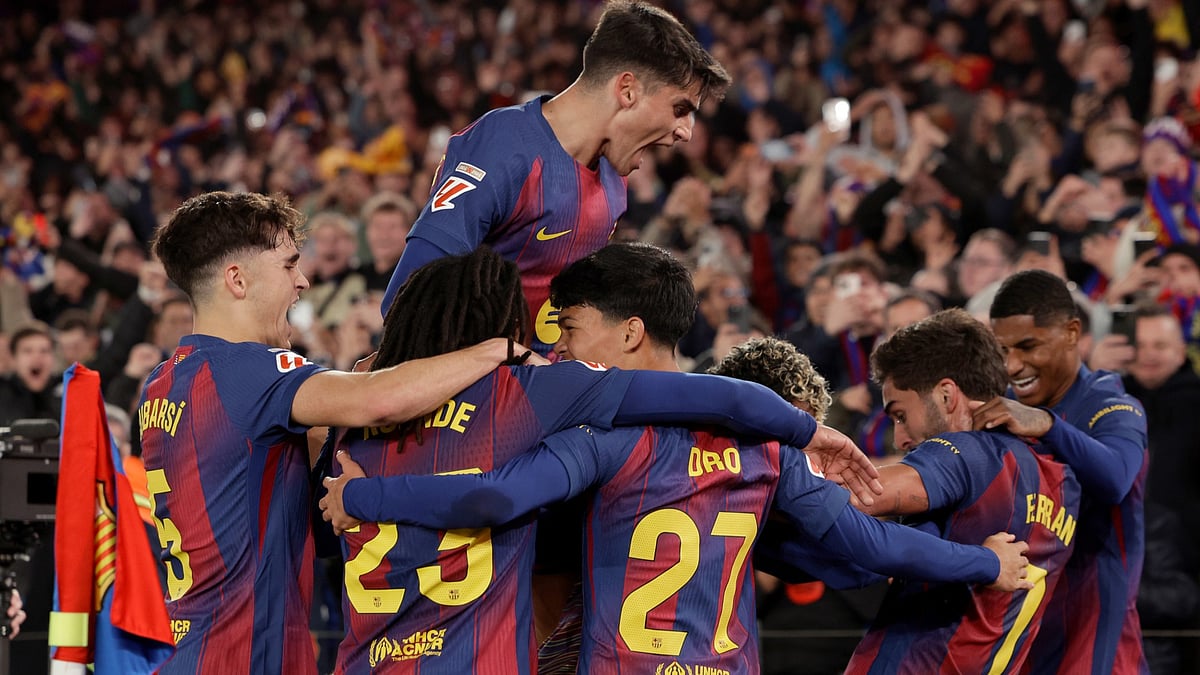 Barcelona's Ferran Torres celebrates with his teammates after scoring his side's third goal during the La Liga match against Atletico Madrid on December 2, 2025. - null