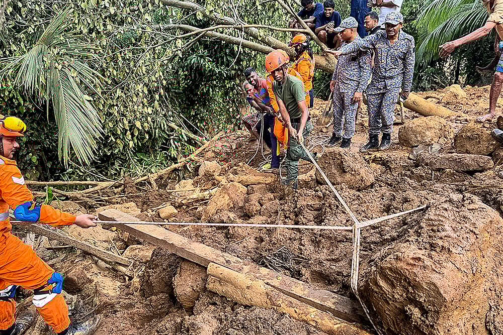 In this image, Rescue workers and National Disaster Response Force (NDRF) personnel during Operation Sagar Bandhu, India's rescue initiative in Sri Lanka following cyclone Ditwah, in Badulla, Sri Lanka. - Photo: @IndiainSL/X via PTI