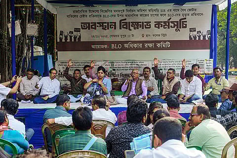 Booth Level Officers (BLOs) under the banner of 'BLO Adhikar Raksha Committee' stage a protest over alleged excessive workload during the ongoing Special Intensive Revision (SIR) of electoral rolls, outside Chief Electoral Officer's (CEO) office, in Kolkata.