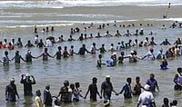 IMAGO / Xinhua : Activists and residents stand in the waters of the Bay of Bengal and shout slogans as they protest against the Russian-built Kudankulam Atomic Power Project, background, at Kudankulam, about 700 kilometers from Chennai, Tamil Nadu state on Sept. 13, 2012. Villagers in India s southern state of Tamil Nadu have renewed their protest against a newly built nuclear plant on Monday, demanding to halt the loading of nuclear fuel in the reactors, which is likely to get done over the next few days, according to local TV channel TIMES NOW. 