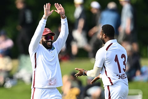 West Indies' bowler Ojay Shields, right, celebrates with teammate John Campbell after taking the wicket of New Zealand's Tom Blundell during their cricket test match in Christchurch, New Zealand.