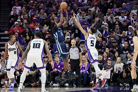 Memphis Grizzlies guard Vince Williams Jr. (5) attempts a shot over Sacramento Kings guard Nique Clifford (5) during the second half of an NBA basketball game in Sacramento, California. 