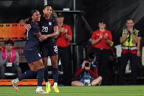 United States forward Catarina Macario (20) celebrates with midfielder Jaedyn Shaw after scoring her side's first goal against Italy during the first half of an international friendly soccer match in Fort Lauderdale, Fla.