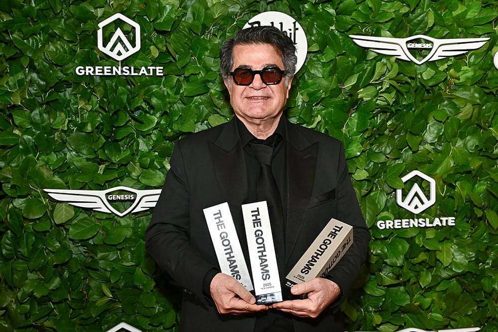 Jafar Panahi poses with the awards for best international feature, best original screenplay and best director at The Gotham Film Awards at Cipriani Wall Street in New York. - Photo by Evan Agostini/Invision/AP