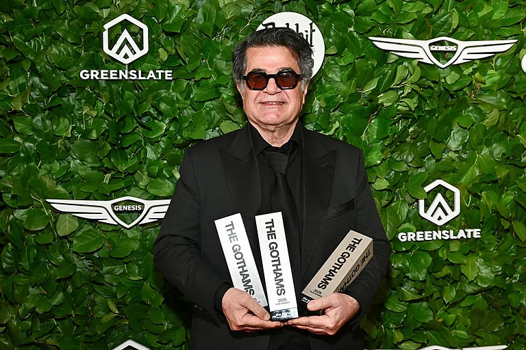 Jafar Panahi poses with the awards for best international feature, best original screenplay and best director at The Gotham Film Awards at Cipriani Wall Street in New York. - Photo by Evan Agostini/Invision/AP