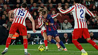 | Photo: AP/Joan Monfort : Atletico Madrid's Pablo Barrios fights for the ball against Barcelona's Dani Olmo during their Spanish La Liga match on December 2, 2025.