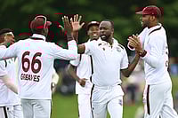 | Photo: Andrew Cornaga/Photosport via AP : West Indies bowler Kemar Roach, second right, celebrates with teammates after taking the wicket of New Zealand's Devon Conway during their cricket test match in Christchurch, New Zealand.