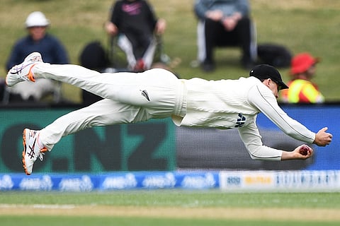 New Zealand's Will Young takes a catch to dismiss West Indies'John Campbell during their cricket test match in Christchurch, New Zealand.