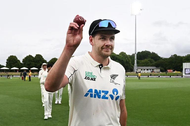 New Zealand's Jacob Duffy hold up the ball after taking 5 wickets against the West Indies during the second day of their cricket test match in Christchurch, New Zealand. - | Photo: Andrew Cornaga/Photosport via AP