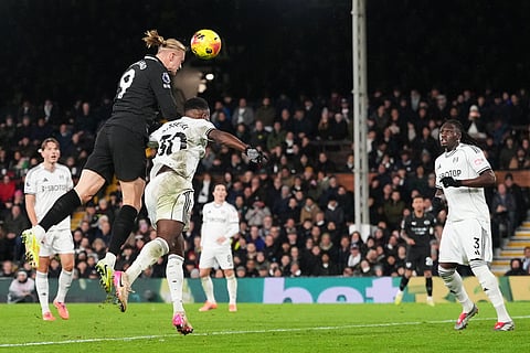 Manchester City's Erling Haaland, second left, makes an attempt on goal during the English Premier League soccer match between Fulham and Manchester City in London.