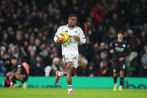 Fulham's Samuel Chukwueze celebrates after scoring his sides third goal during the English Premier League soccer match between Fulham and Manchester City in London.