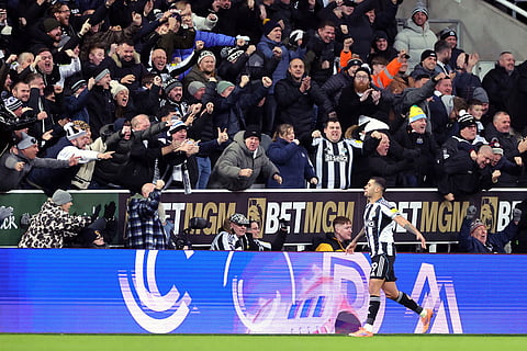 Newcastle United's Bruno Guimaraes celebrates scoring their side's first goal of the game during their English Premier League soccer match against Tottenham in Newcastle, England.