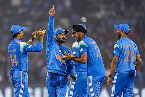 India's Virat Kohli with teammates celebrates the dismissal of South Africa's Quinton de Kock during the second ODI cricket match of a series between India and South Africa, at Shaheed Veer Narayan Singh International Stadium, in Raipur, Chhattisgarh.