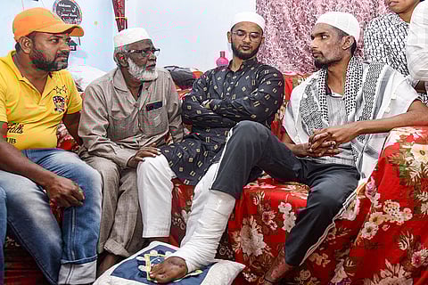 Mohammed Abdul Shoaib (right), the lone survivor of the bus accident in Saudi Arabia's Madina, with his family at his residence, in Hyderabad.