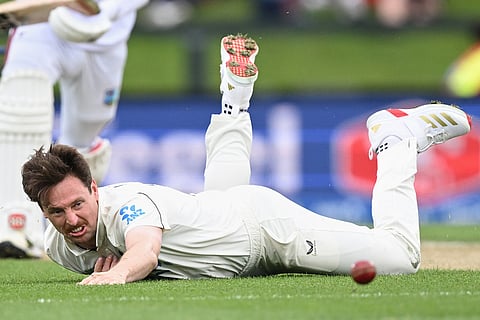 New Zealand's Matt Henry dives while attempting to field against the West Indies during the second day of their cricket test match in Christchurch, New Zealand.