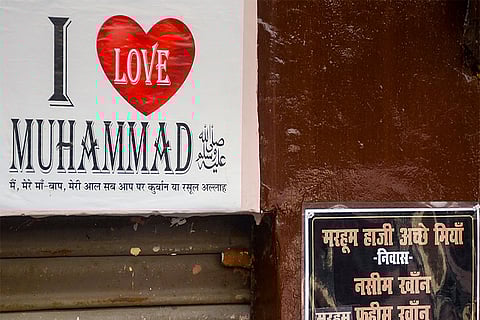 A banner hangs outside a building, linked to an associate of arrested cleric Maulana Tauqeer Raza Khan, one of the accused in the Bareilly violence case, before the building's demolition by authorities, in Bareilly, Uttar Pradesh.