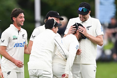 New Zealand's Jacob Duffy, right, congratulates teammate Devon Conway on his catch to dismiss the West Indies Tagenarine Chanderpaul during the second day of their cricket test match in Christchurch, New Zealand.