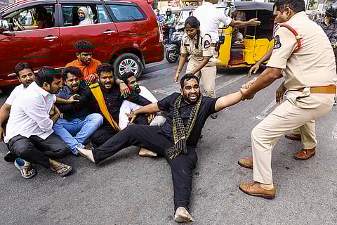 Police personnel detain activists during a protest over Telangana Chief Minister Revanth Reddy's remarks on Hindu deities, in Hyderabad.