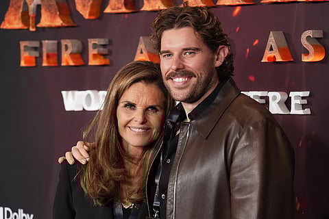 Maria Shriver, left, and her son Christopher Schwarzenegger pose together at the premiere of the film "Avatar: Fire and Ash" at Dolby Theatre in Los Angeles. 