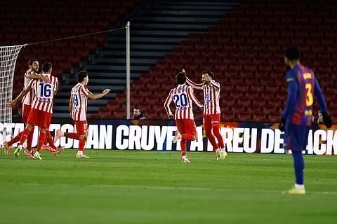 Atletico Madrid's Alex Baena celebrates the opening goal during a Spanish La Liga soccer match between Barcelona and Atletico de Madrid, in Barcelona, Spain.
