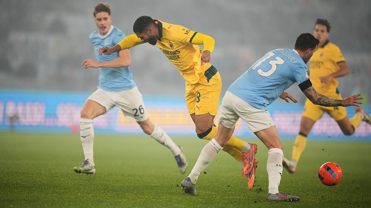 Lazio's Alessio Romagnoli tackles AC Milan's Ruben Loftus-Cheek during their Coppa Italia round of 16 match on December 4, 2025. - | Photo: AP/Andrew Medichini