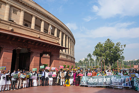 Leader of Opposition in the Rajya Sabha Mallikarjun Kharge with senior Congress MP Sonia Gandhi and other opposition MPs at a protest over the issue of air pollution in the national capital, during the Winter session of Parliament, in New Delhi.