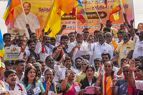 Paattali Makkal Katchi (PMK) MLAs Arul Ramadas, holding a mic, and GK Mani, with other PMK members, during a protest condemning the Election Commission of India for allegedly using forged documents to extend former MP and PMK President Anbumani Ramadoss's presidency till August 2026, at Jantar Mantar in New Delhi.