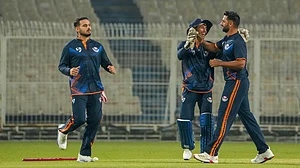 Photo: PTI : Jammu and Kashmir's Auqib Nabi, right, celebrates with teammates after taking the wicket of Bihar's Vaibhav Suryavanshi during a Syed Mushtaq Ali Trophy 2025 match in in Kolkata.