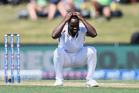 West Indies' Kemar Roach crouches after bowling against New Zealand on day 3 during their cricket test match in Christchurch, New Zealand.