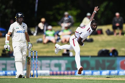 West Indies' Jayden Seales, right, bowls against New Zealand on day 3 during their cricket test match in Christchurch, New Zealand.